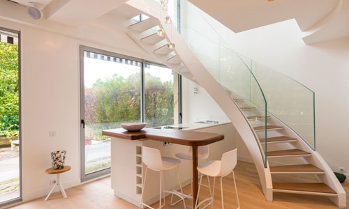 Glass stairway and window installations that can use glass bonding adhesives for assembly.